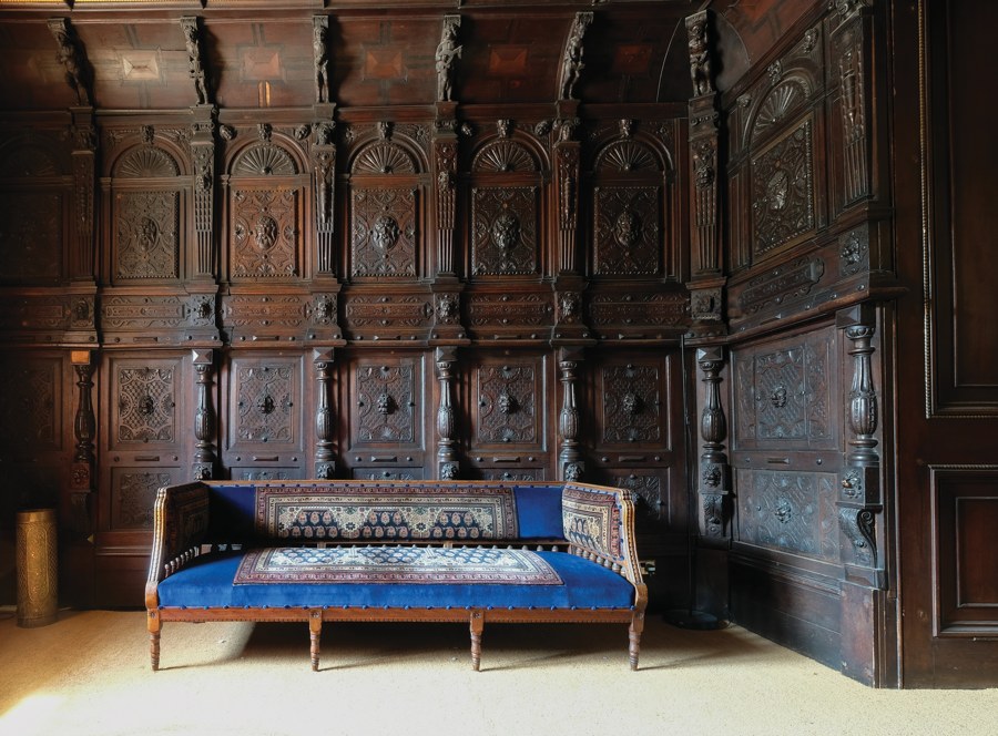 The wood-panelled entrance hall at Camden Place